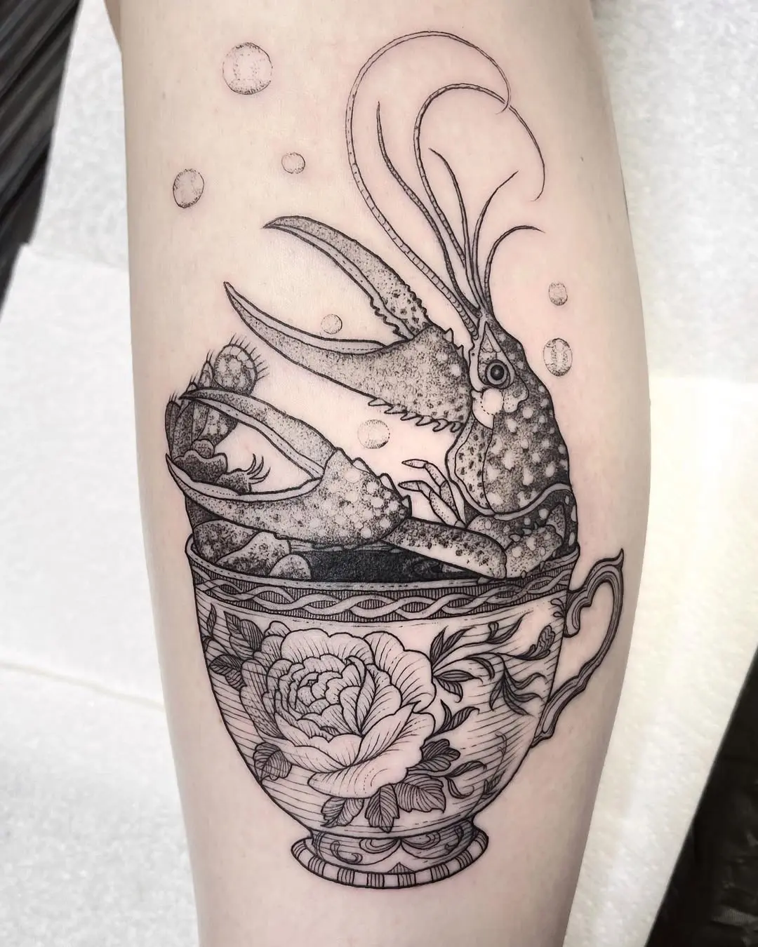 Unique lobster tattoo in decorative teacup