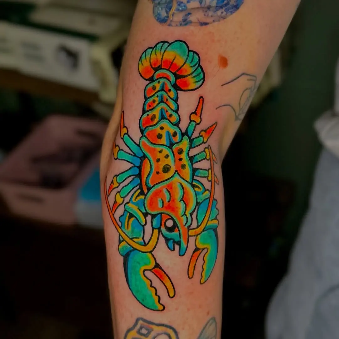 Colorful lobster tattoo bursting with vibrant hues