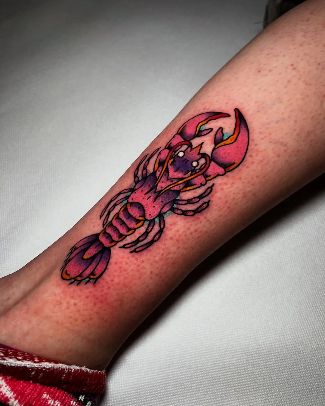 Bold lobster tattoo with vibrant colors
