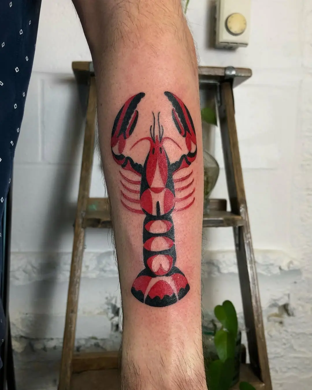 Bold Red Lobster Tattoo with Black Accents