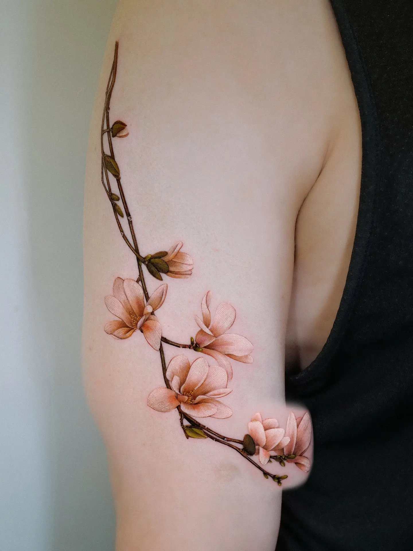 Elegant Magnolia Tattoo on the Arm
