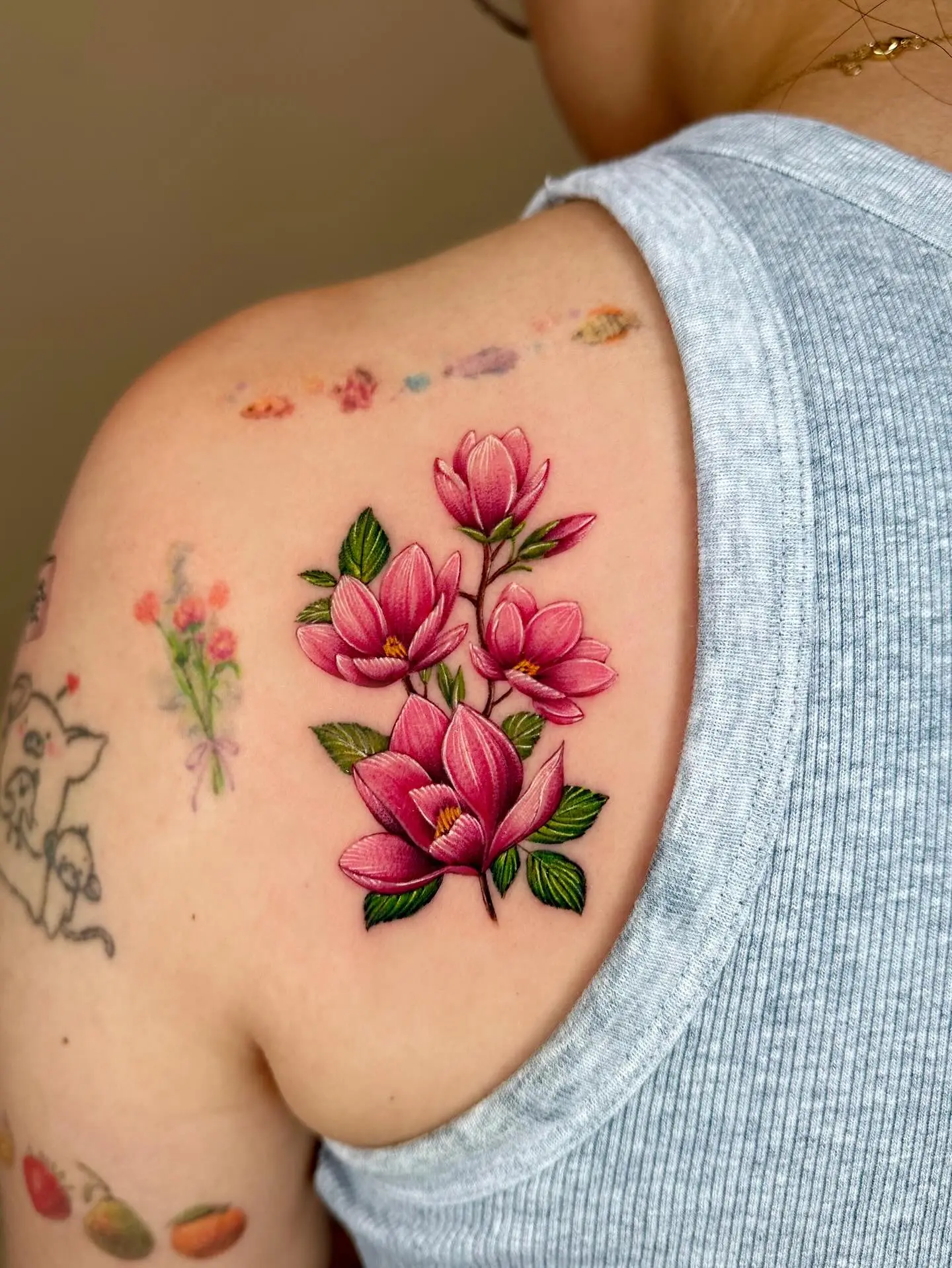 Elegant magnolia flower tattoo on the shoulder