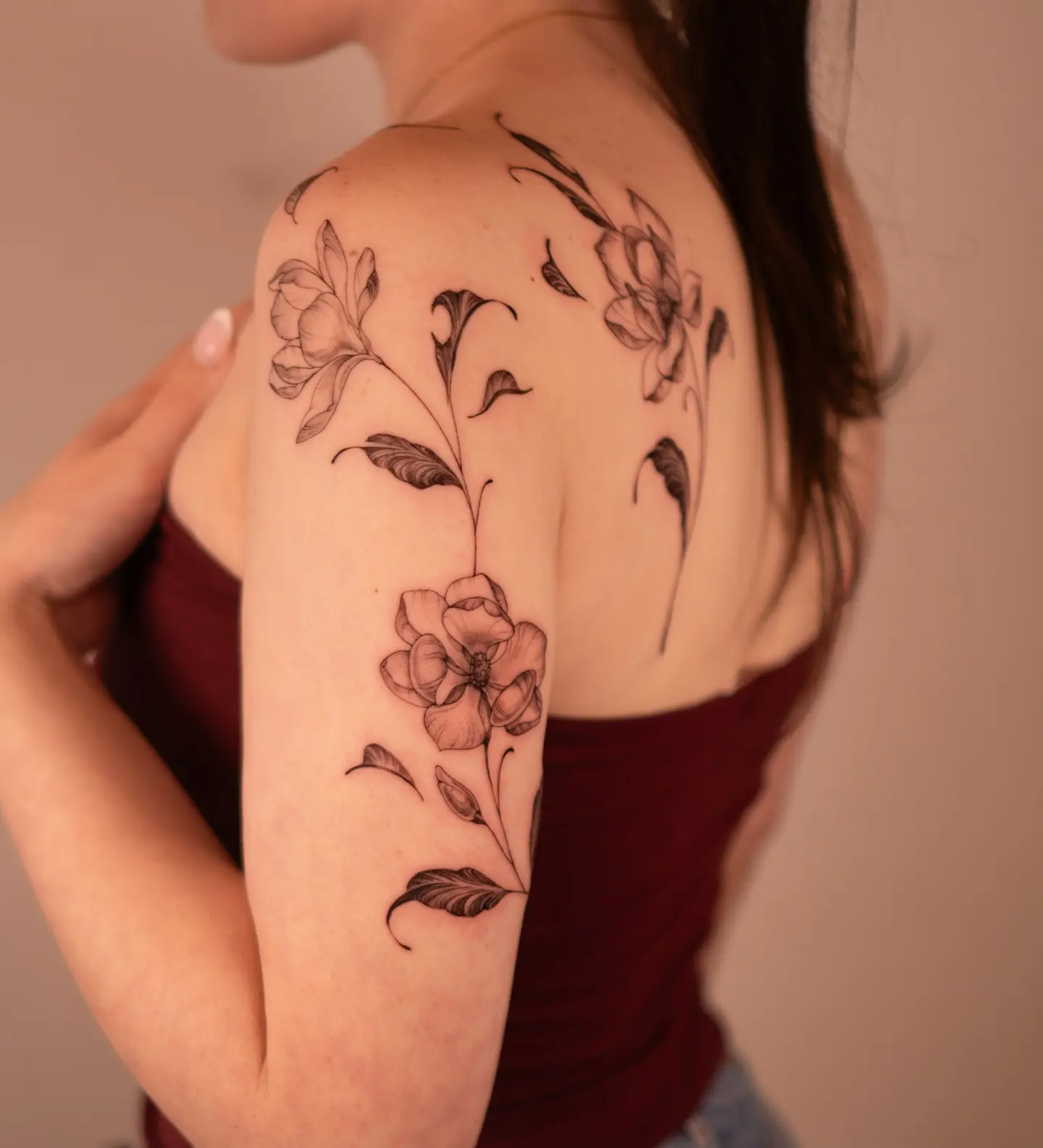 Delicate magnolia tattoo design on shoulder