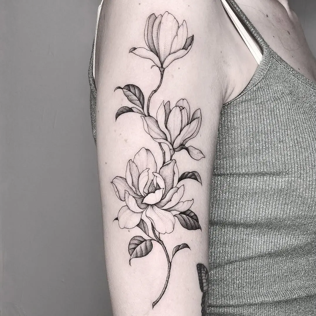 Elegant magnolia tattoo on the arm