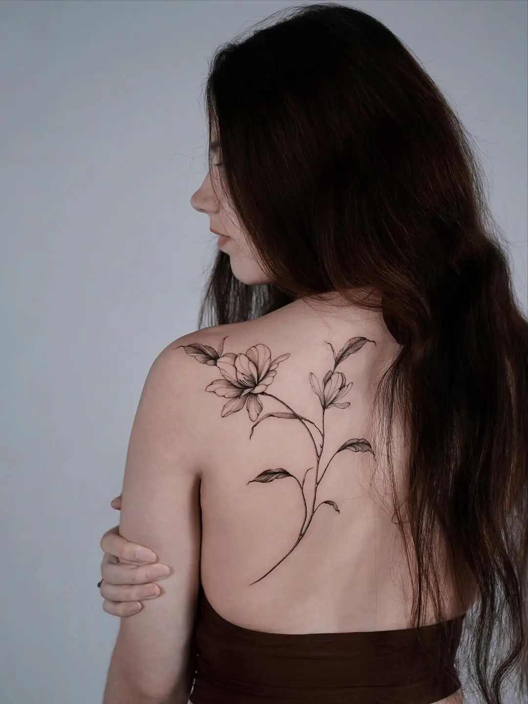 Elegant Magnolia Tattoo on the Back