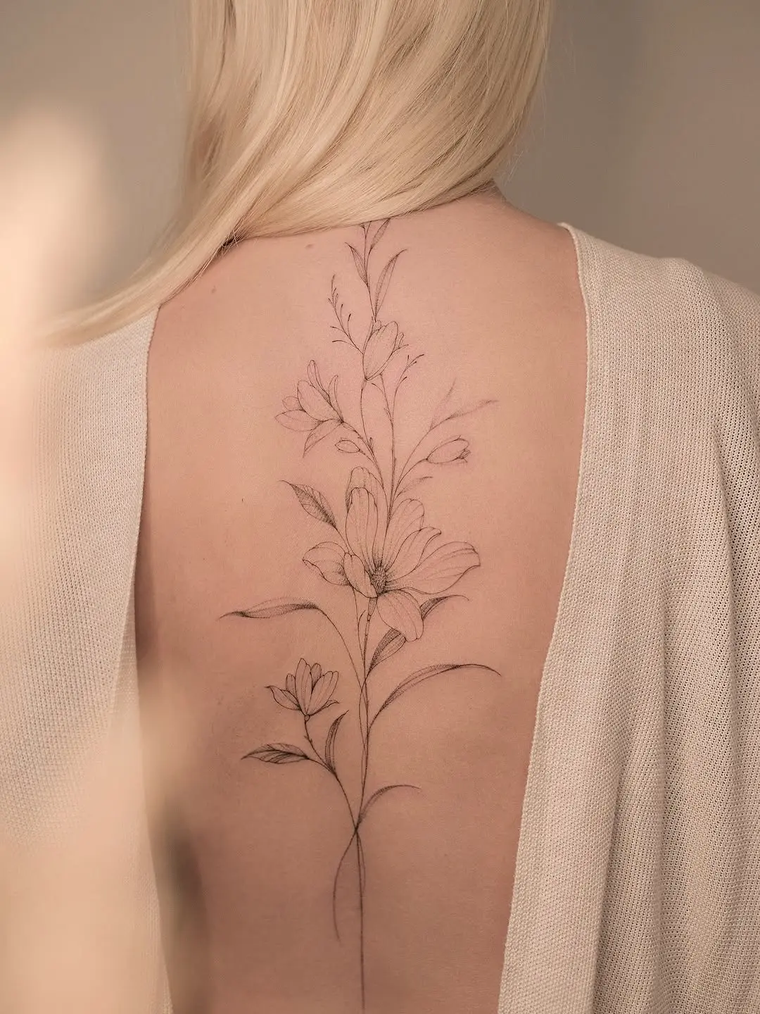 Elegant Magnolia Tattoo Captured on a Back