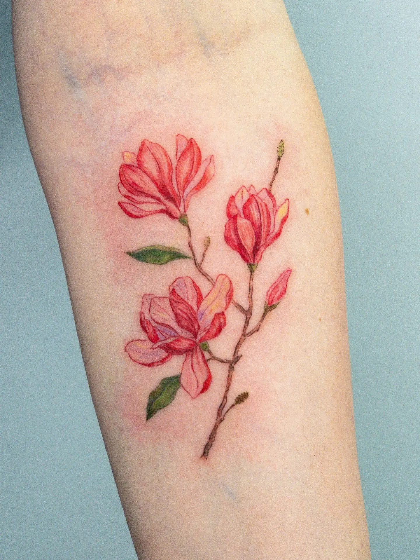 Stunning magnolia tattoo with vibrant colors