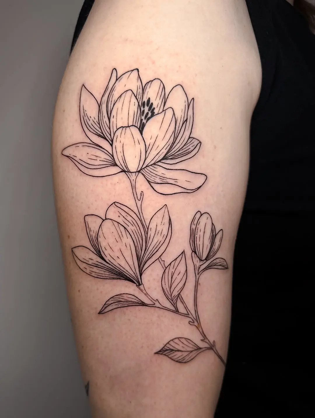 Elegant magnolia tattoo in exquisite detail