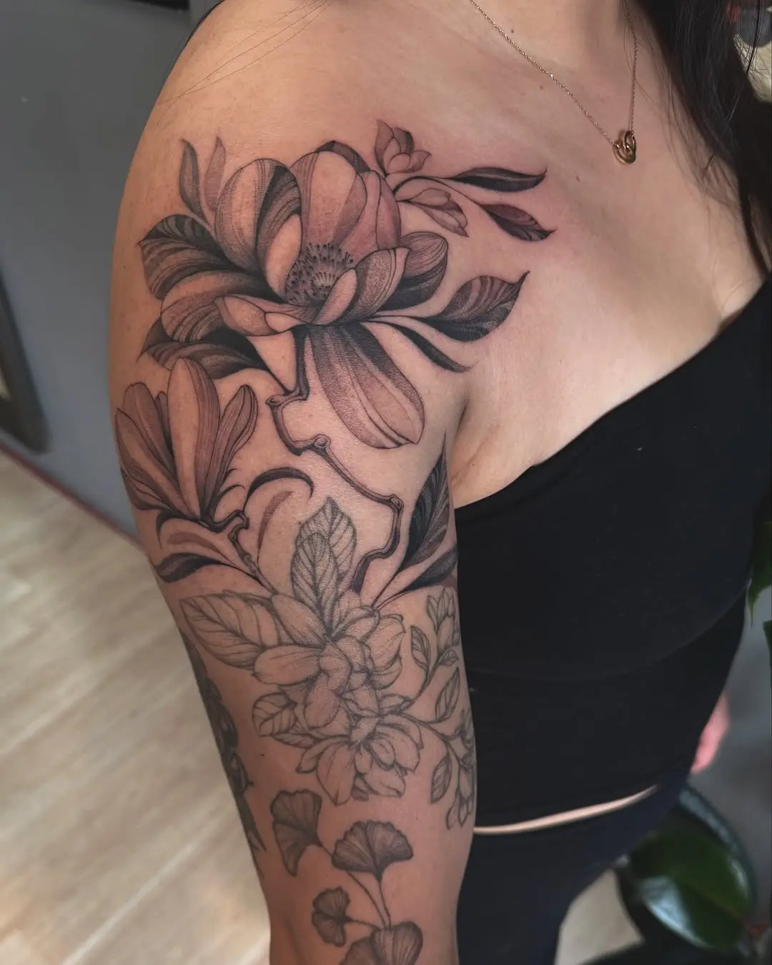 Elegant Magnolia Tattoo Sleeve on Arm