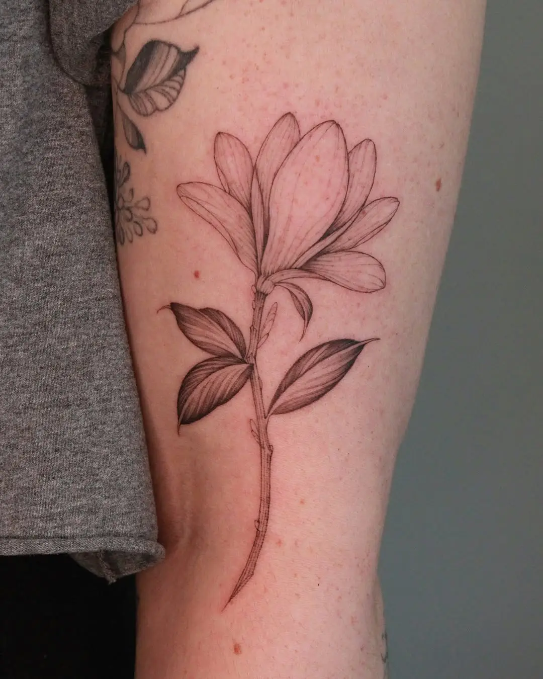 Elegant magnolia tattoo showcasing natural beauty