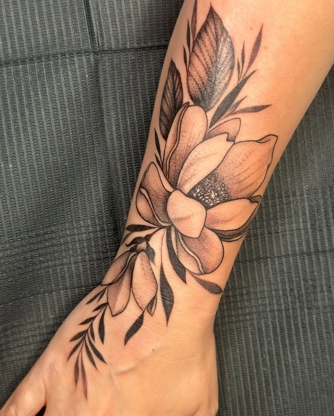 Elegant magnolia tattoo with intricate details