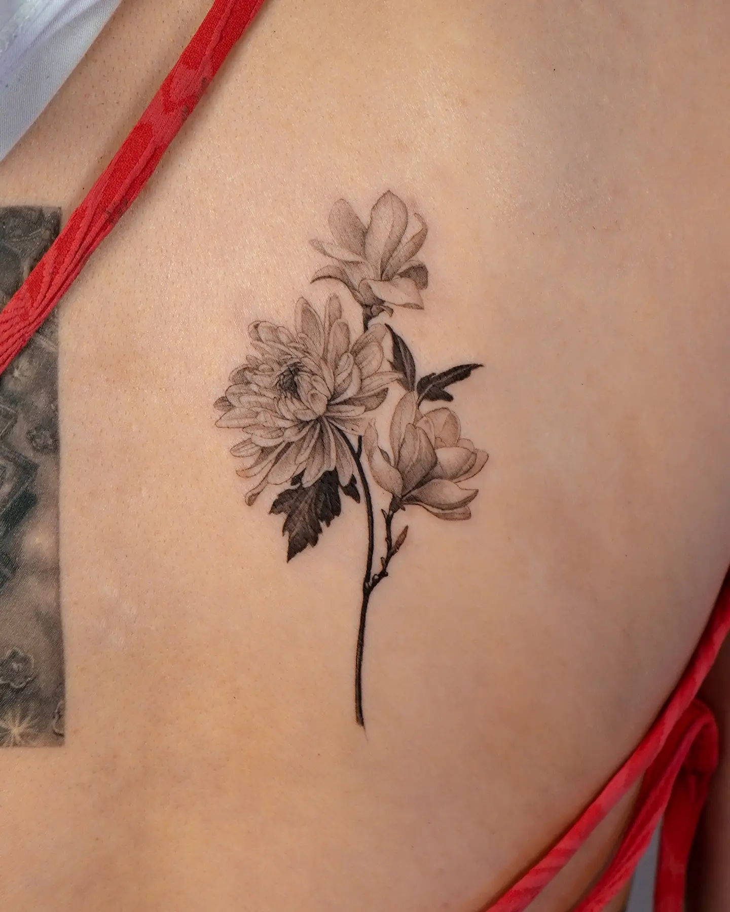 Elegant magnolia tattoo showcasing fine details