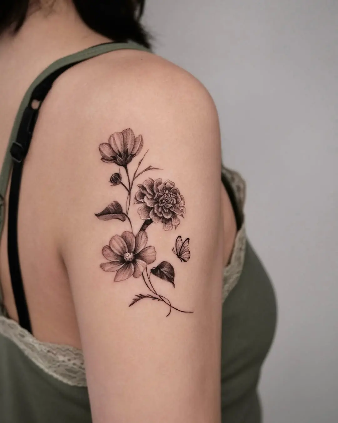 Elegant marigold and flower blend tattoo
