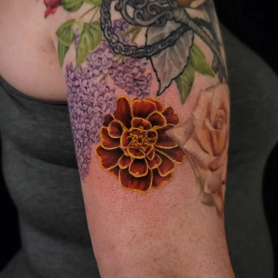 Vibrant marigold flower tattoo in full bloom