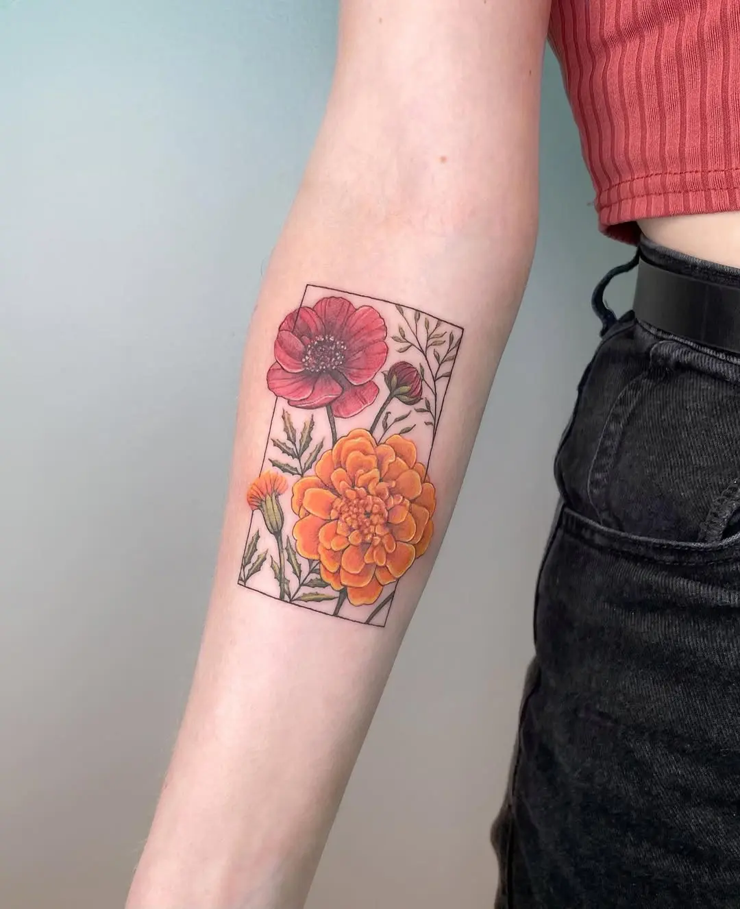 Beautiful marigold and poppy tattoo design