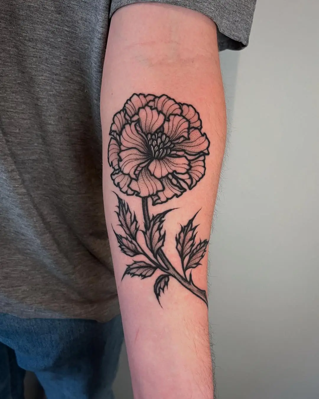 Elegant Marigold Tattoo in Black Ink