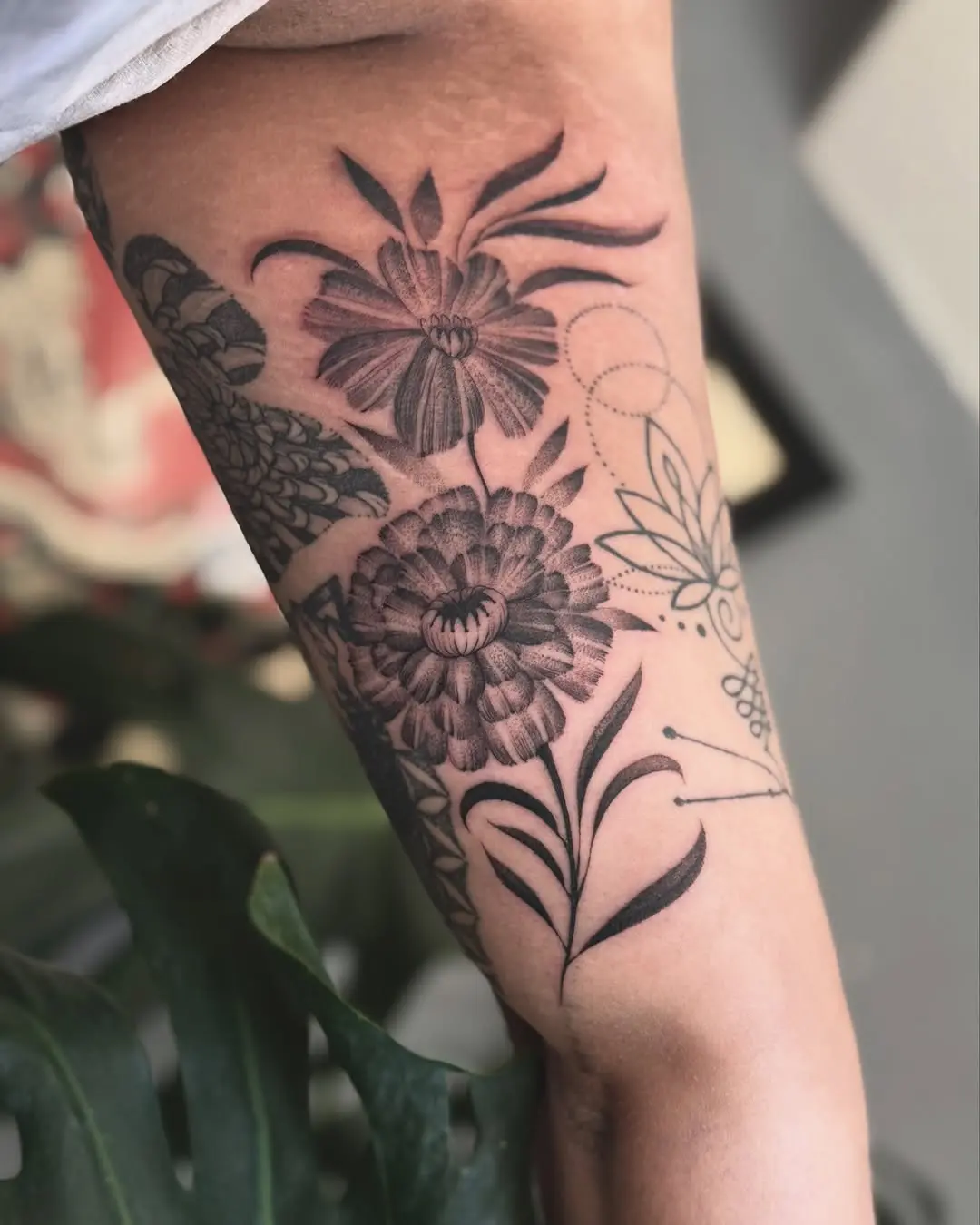 Stunning marigold tattoo with intricate details