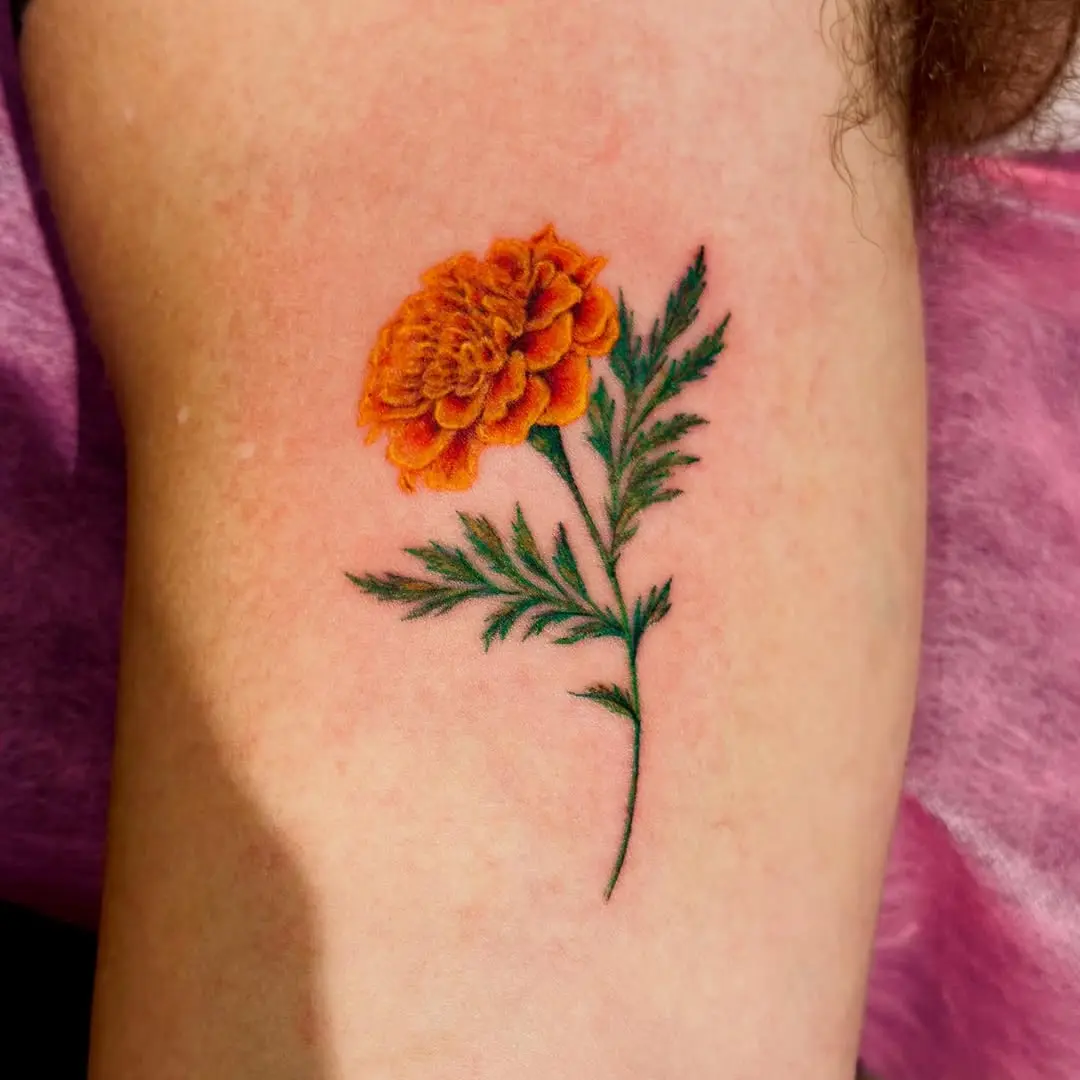 Stunning marigold tattoo with striking colors