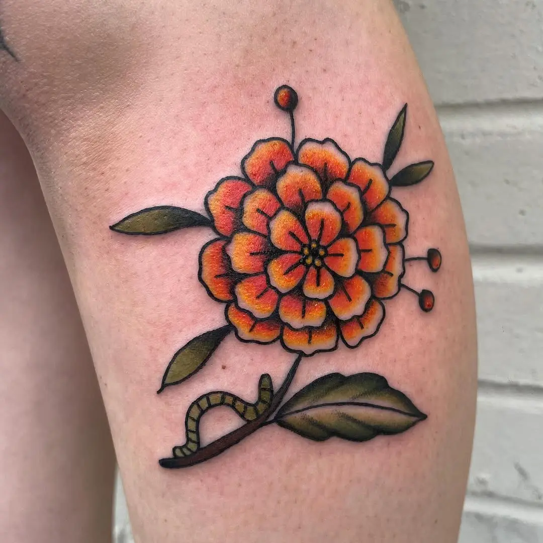 Bold marigold tattoo showcasing vibrant colors