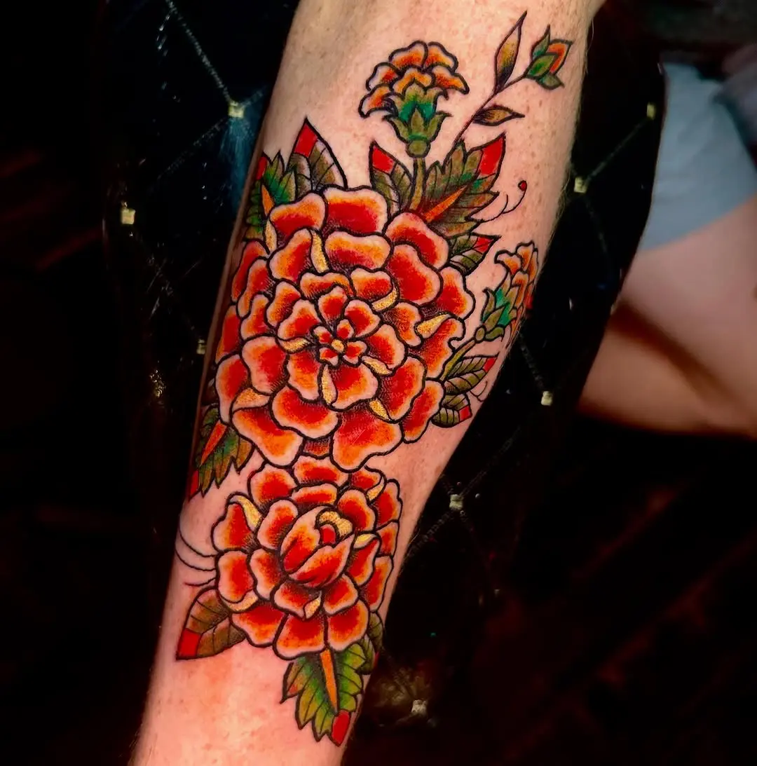Bold marigold tattoo with vibrant floral elements