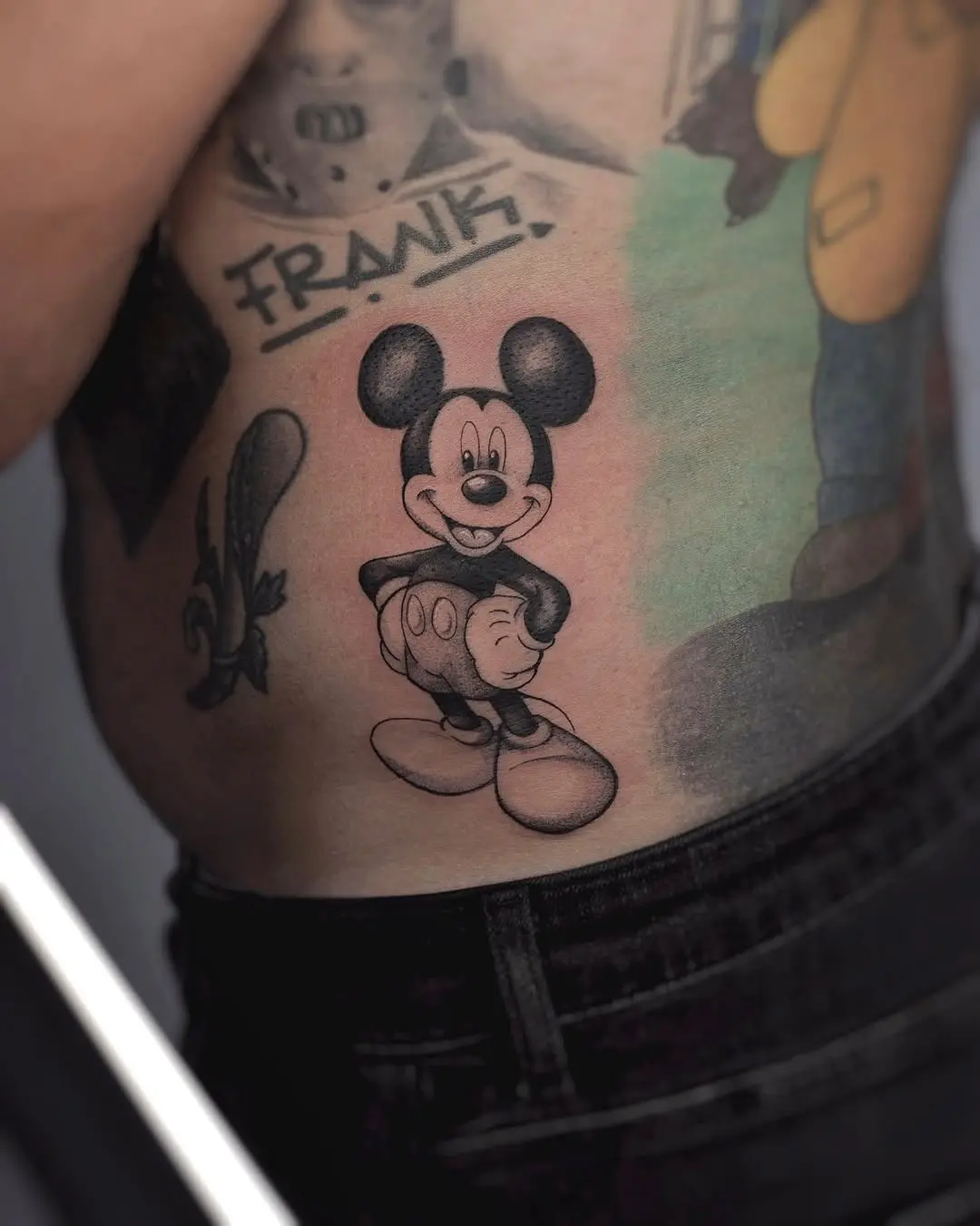 Classic Mickey Mouse tattoo on rib cage