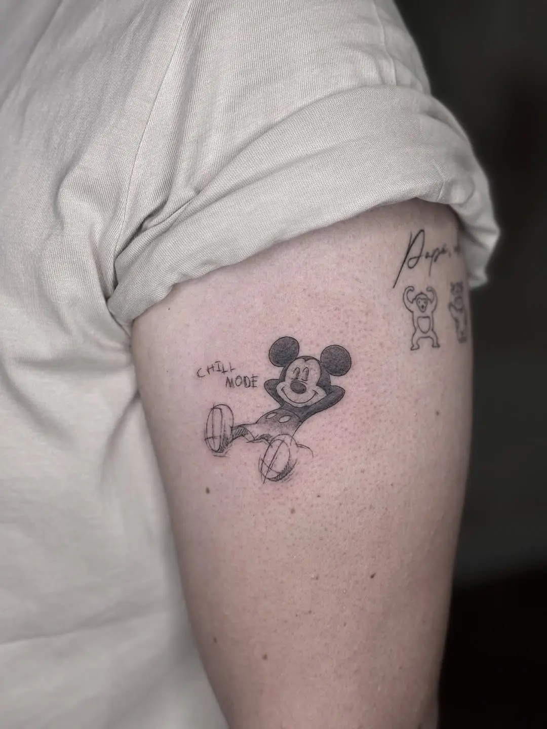 Whimsical Mickey Mouse tattoo in chill mode