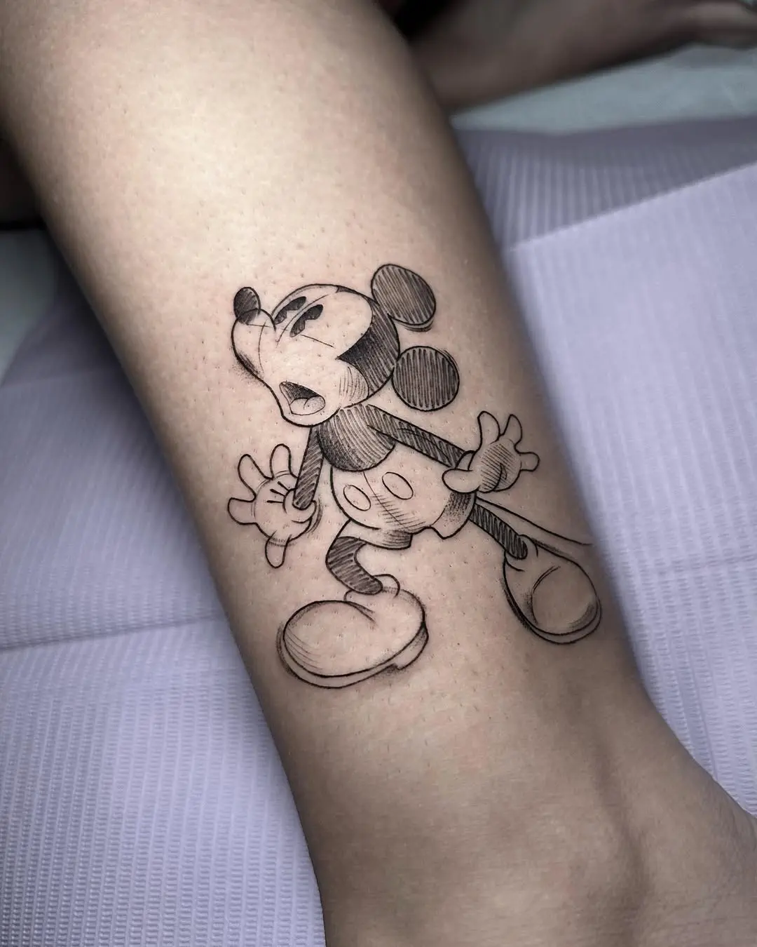 Expressive Mickey Mouse Tattoo in Bold Ink
