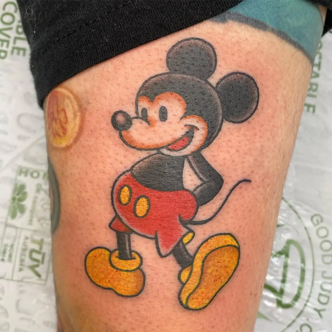 Playful Mickey Mouse tattoo with vibrant colors