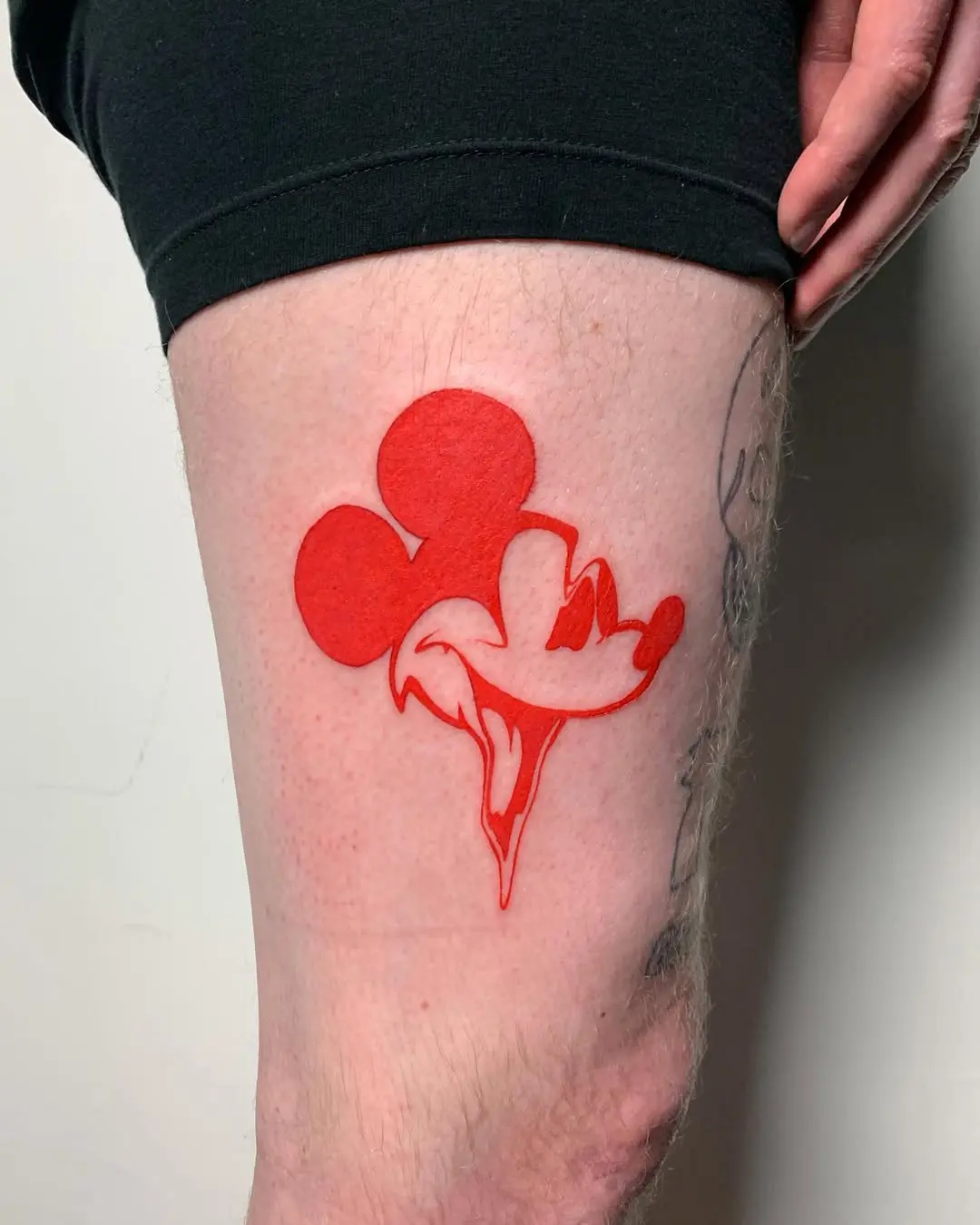 Vibrant Mickey Mouse Tattoo with Dripping Effect