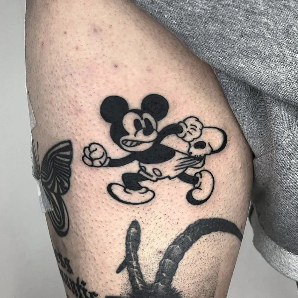 Energetic Mickey Mouse tattoo in motion