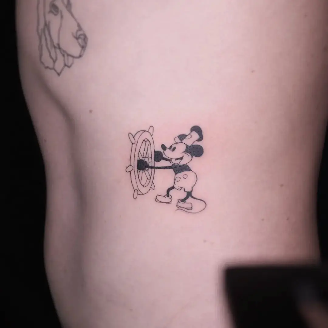Charming Mickey Mouse with a steering wheel tattoo