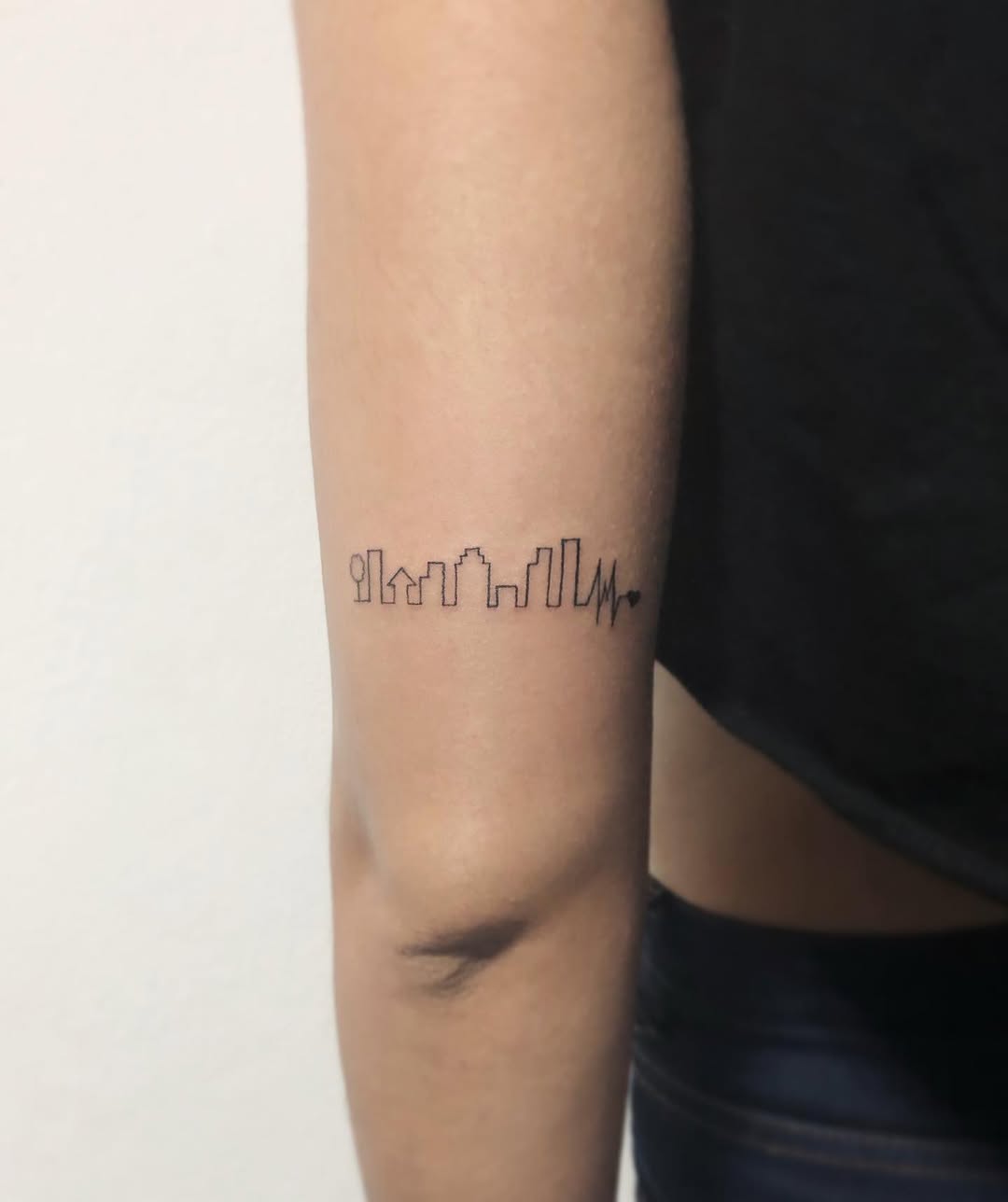 Stylish Skyline Tattoo with Heartbeat Line