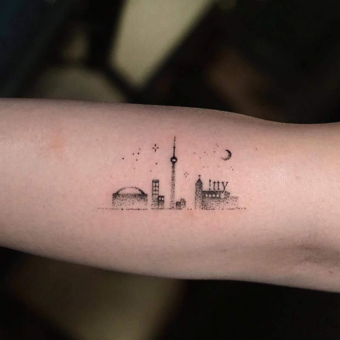 Charming minimalist Toronto skyline tattoo design