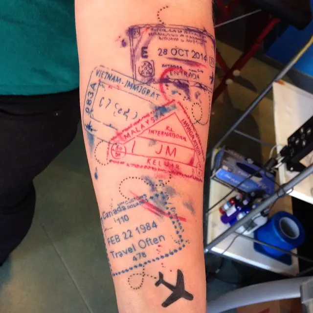 Creative Travel-Inspired Tattoo Featuring Stamps