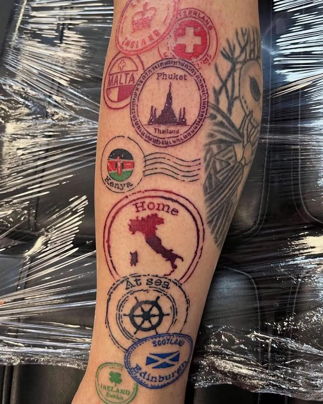 Unique passport stamps tattooed on forearm