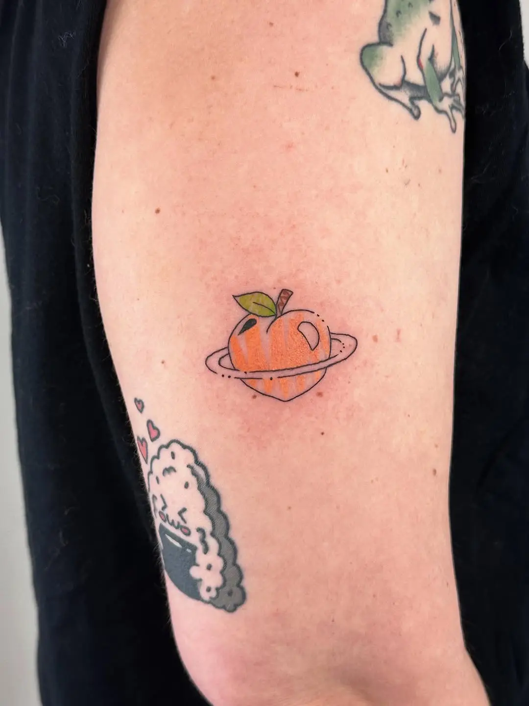 Creative Peach Tattoo with a Cosmic Twist