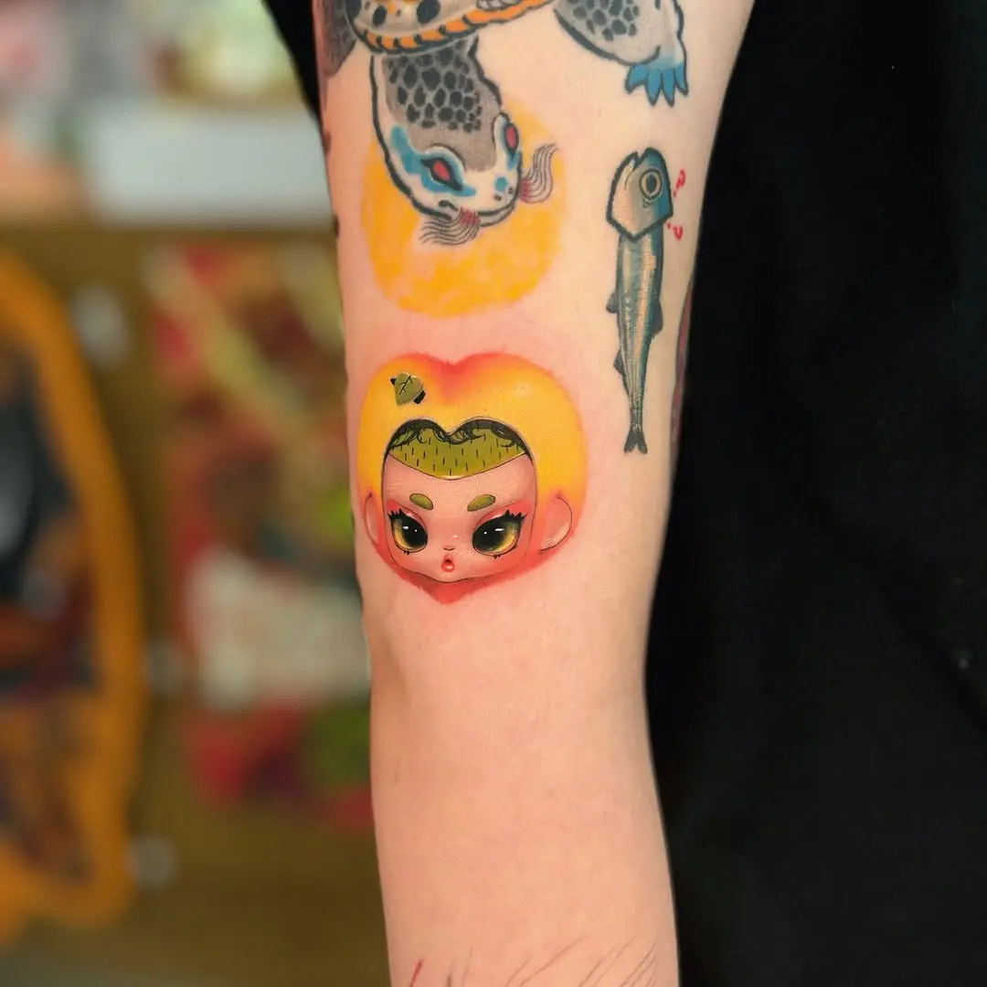 Whimsical peach tattoo with a playful design