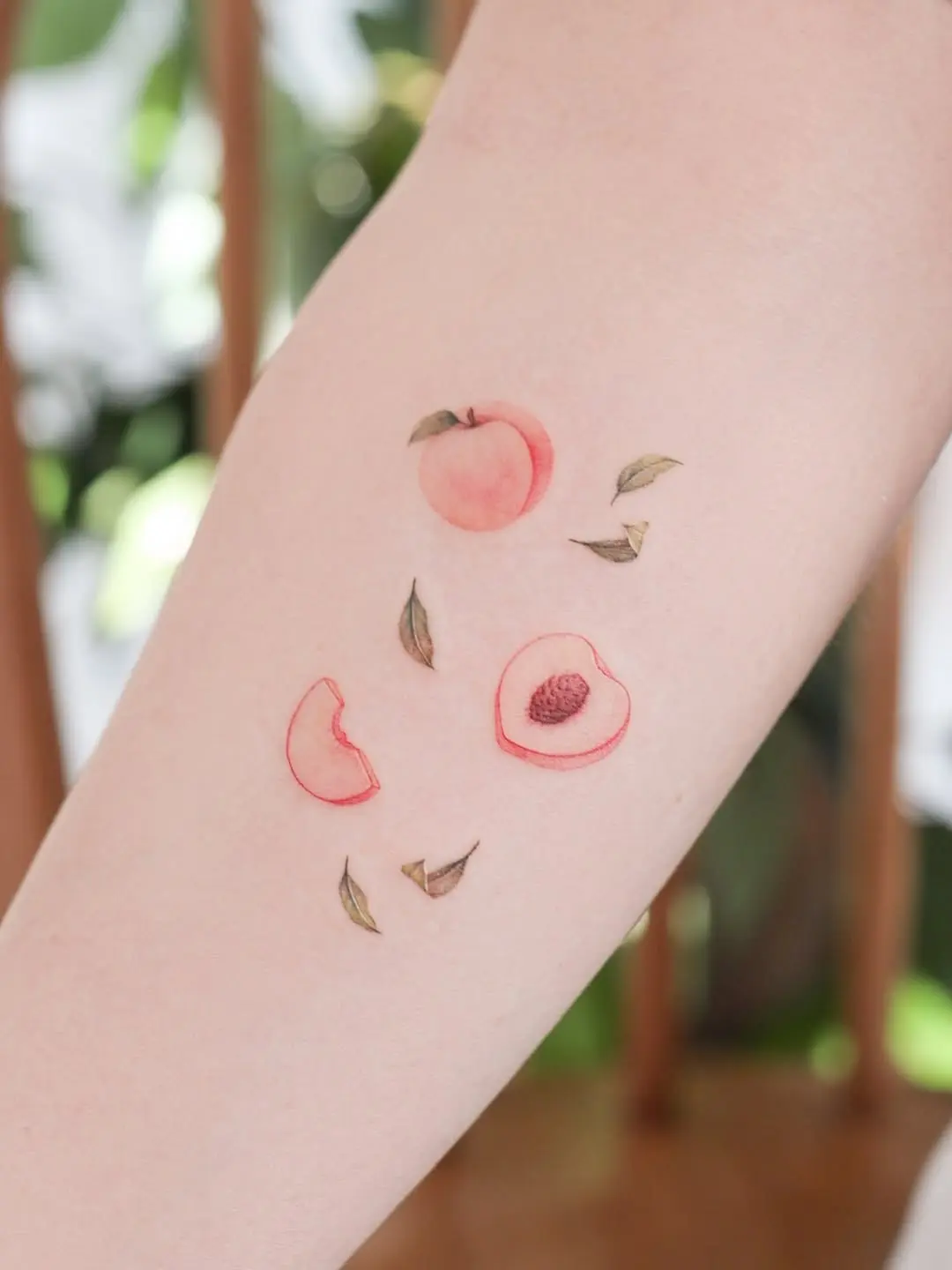 Charming peach tattoos with delicate details