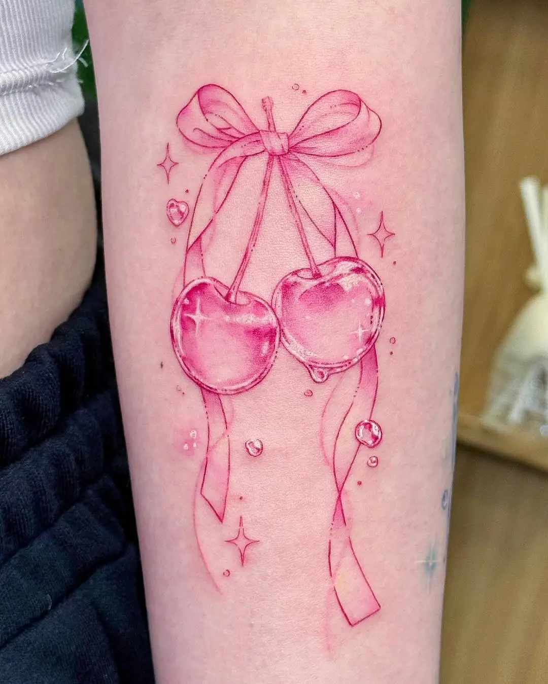 Delicate Pink Cherry Tattoo with Bow
