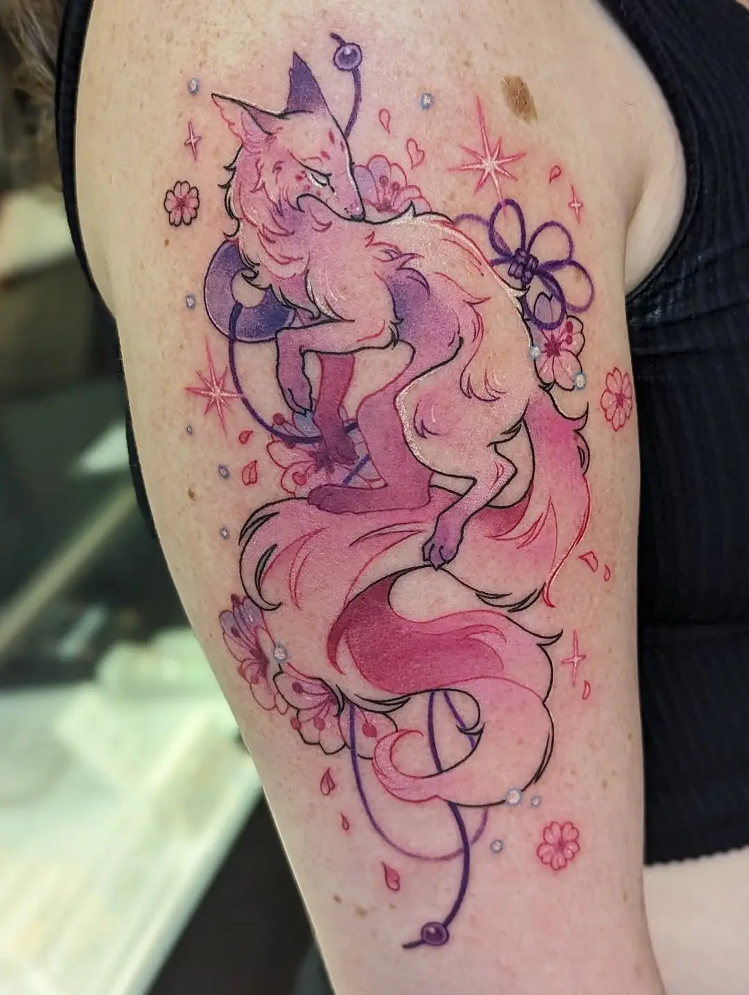 Whimsical pink fox tattoo exudes elegance