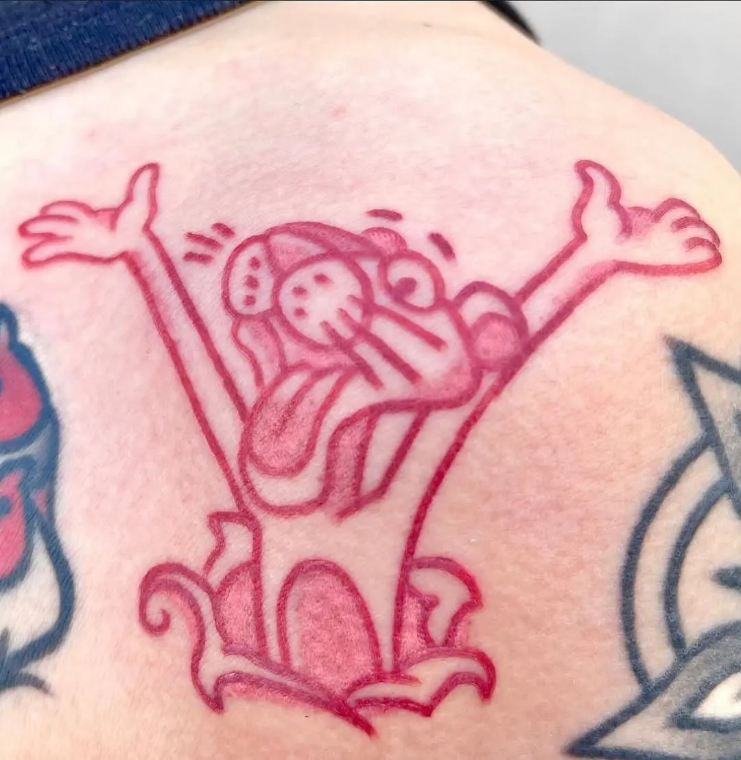 Vibrant pink cartoon character tattoo design
