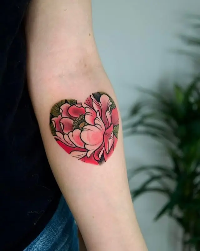 Vibrant pink heart-shaped floral tattoo design