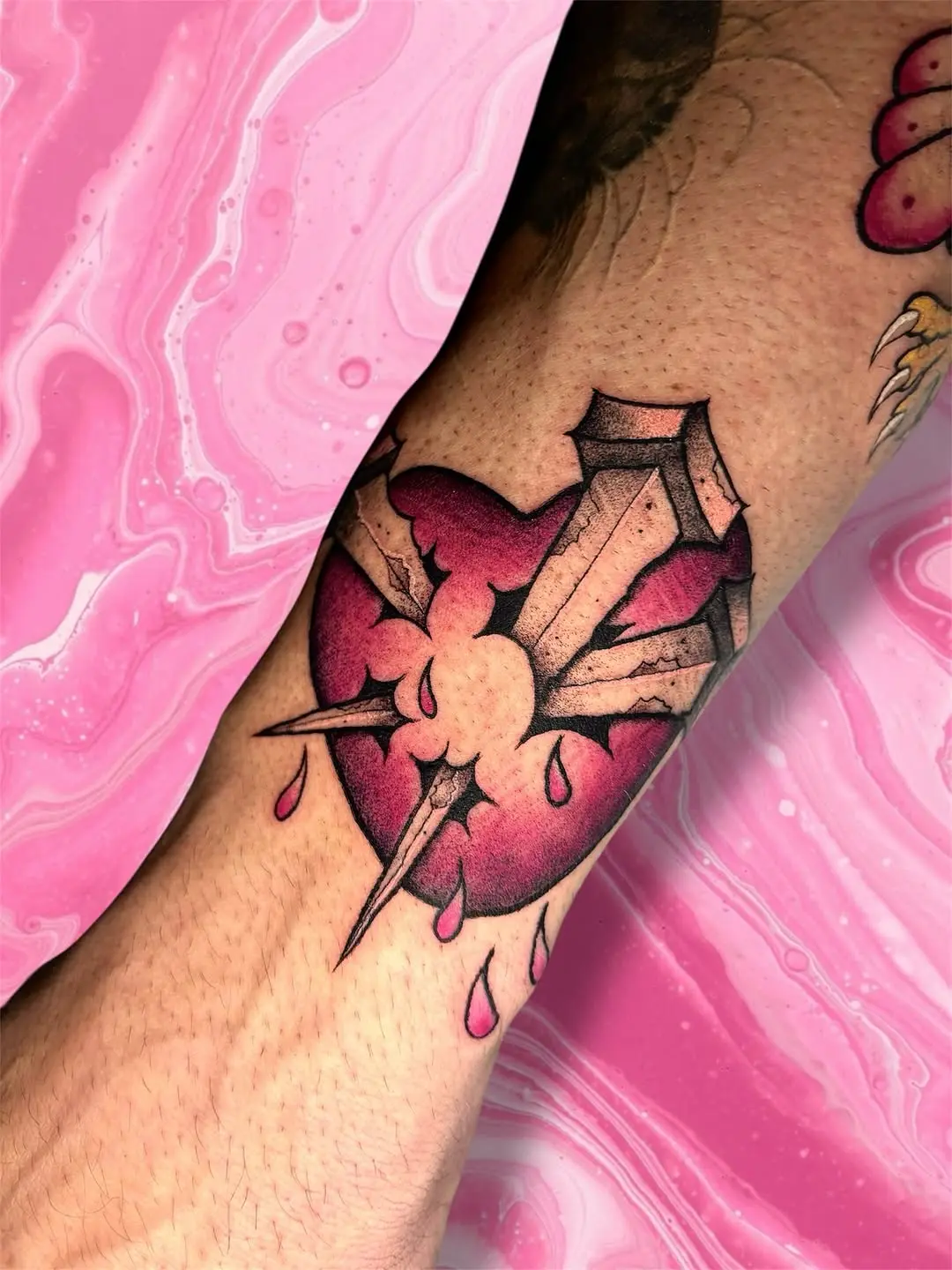Striking Pink Heart Tattoo with Sword