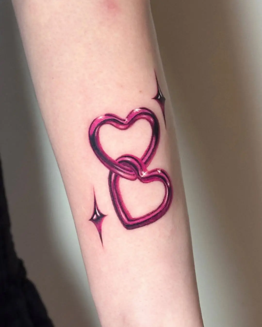 Charming linked pink hearts tattoo design
