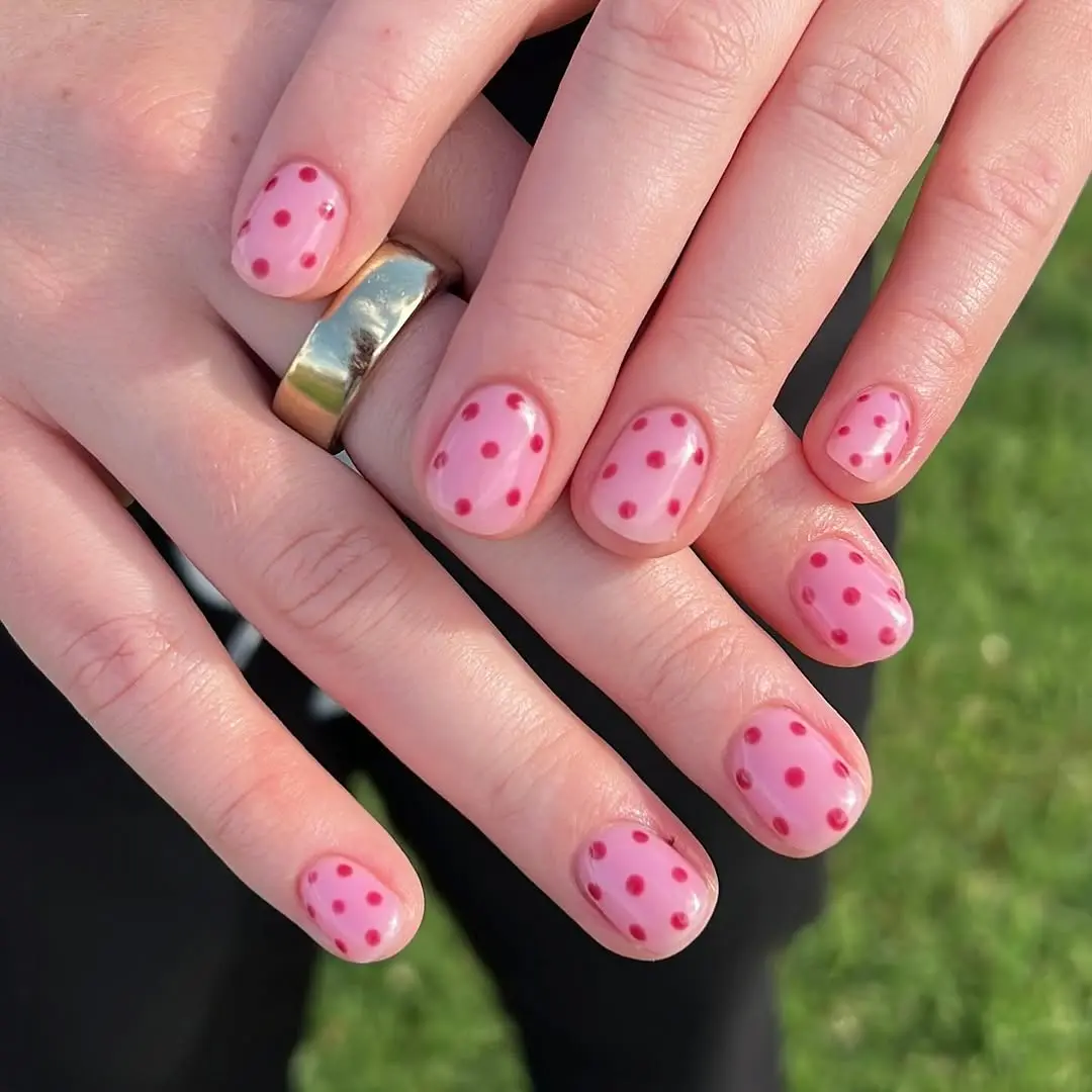Charming pink nails with playful polka dots
