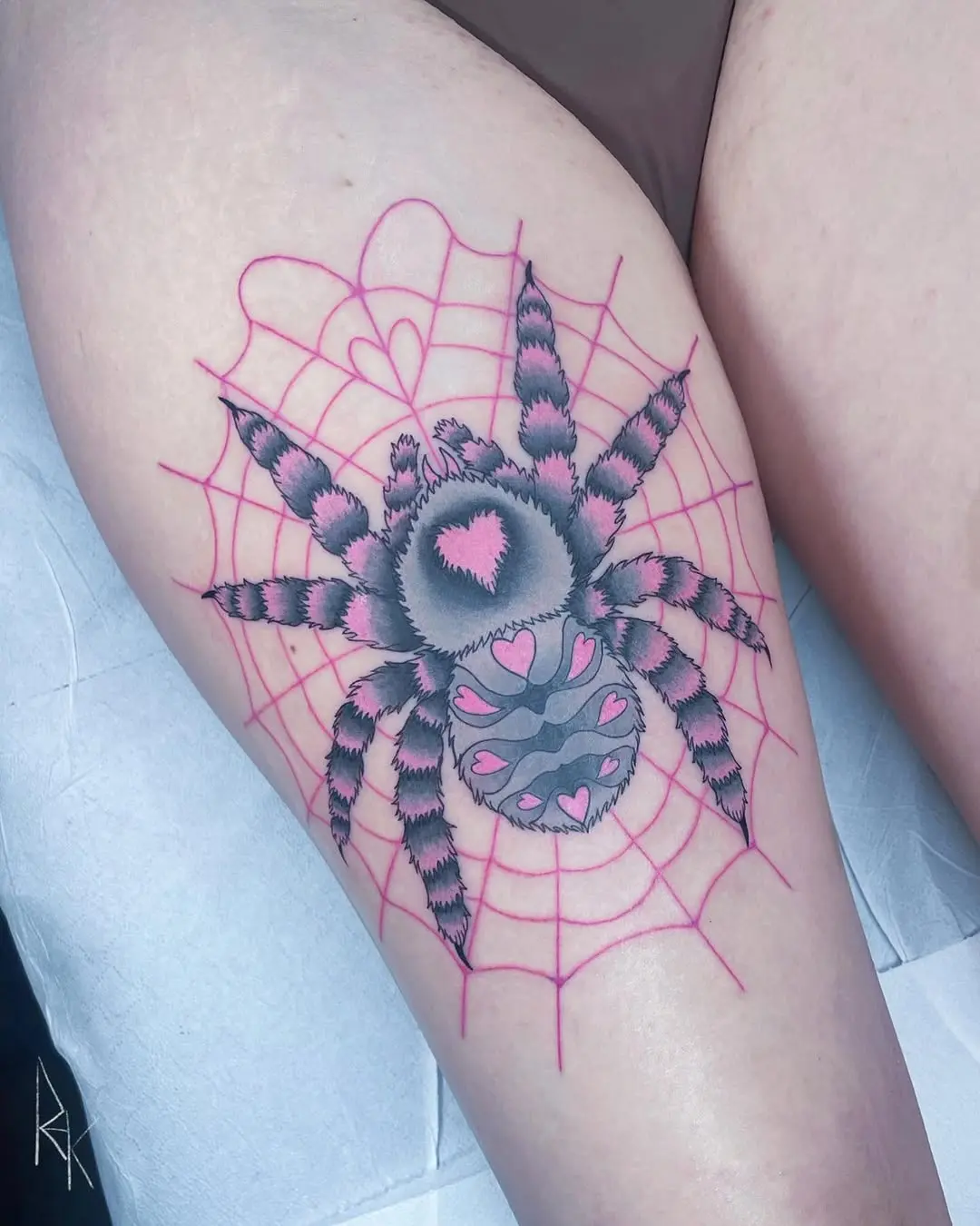 Intricate Pink Spider and Web Tattoo Art