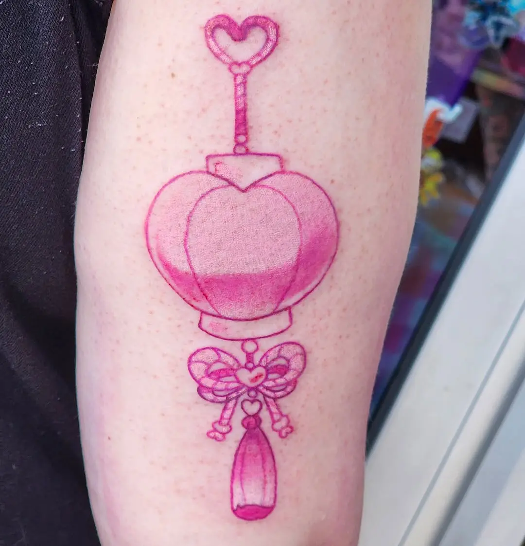 Charming pink tattoo design with whimsical elements