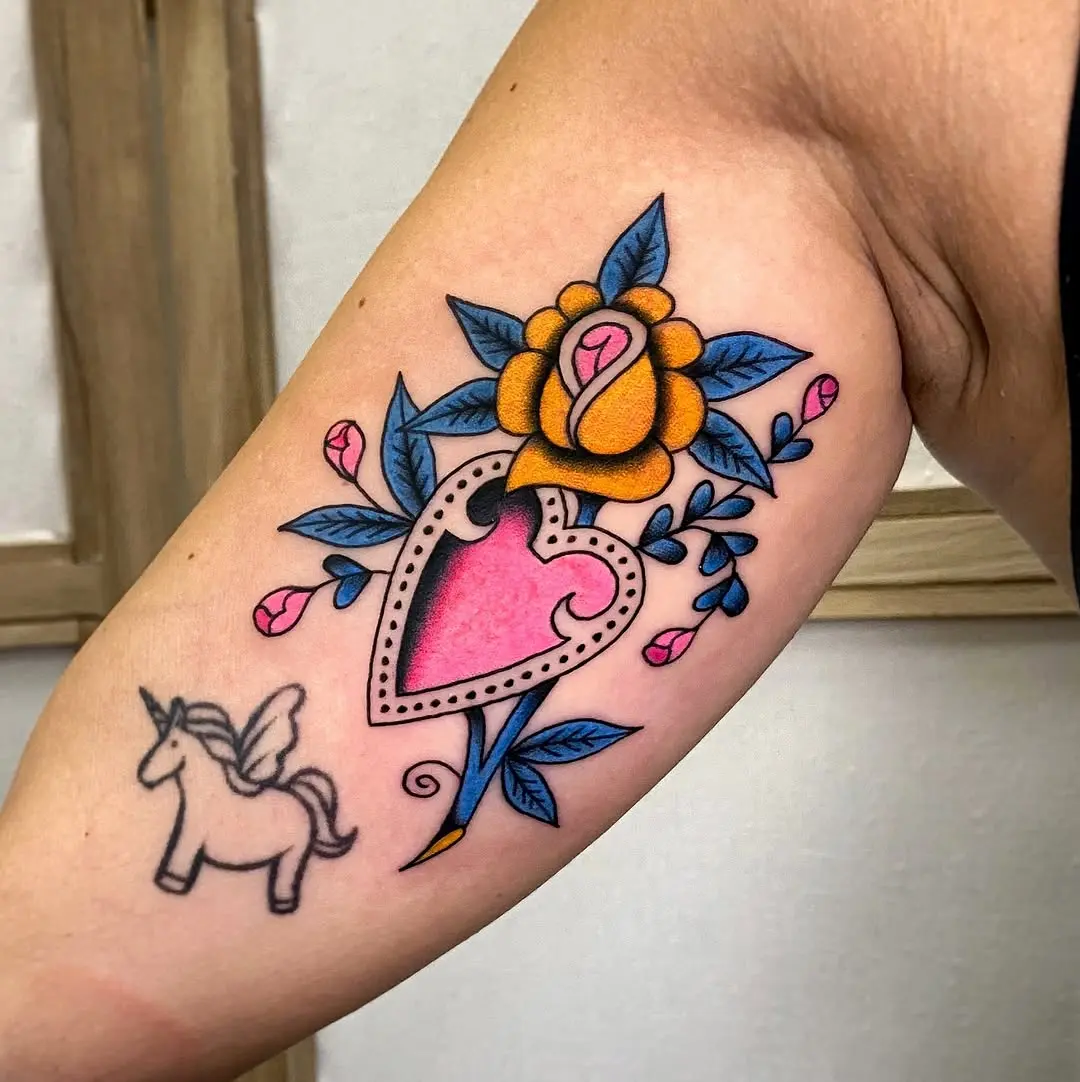 Charming pink heart and floral tattoo design