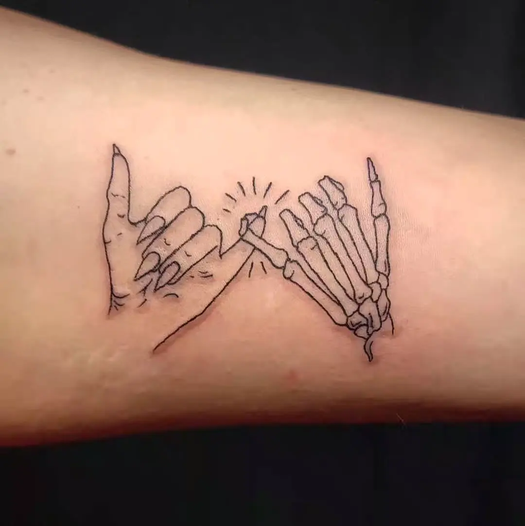 Unique pinky promise tattoo with skeletal hands