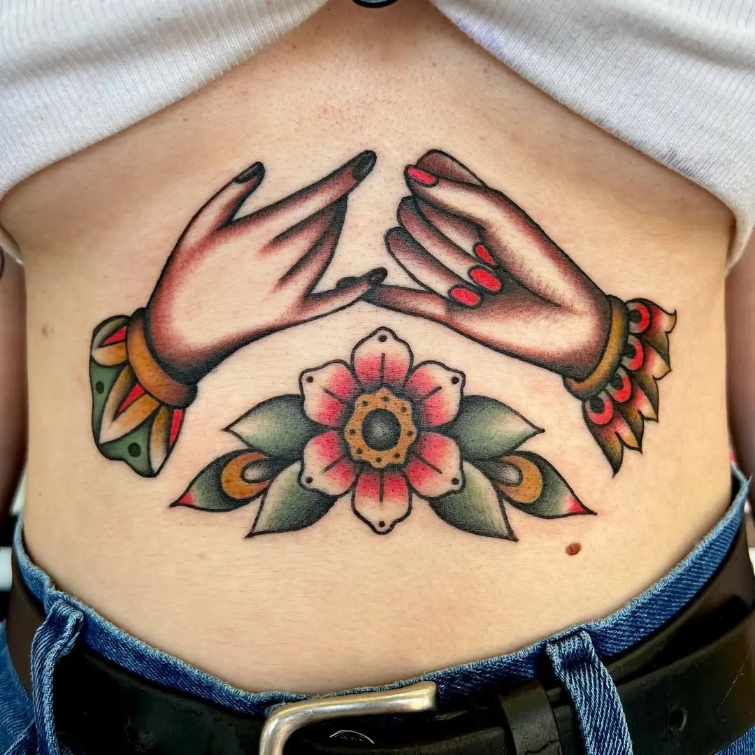 Artistic pinky promise tattoo with floral accents